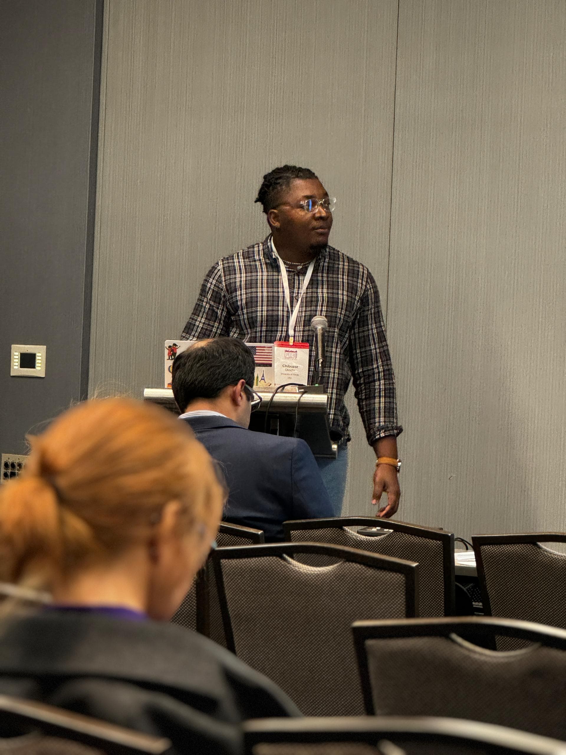 Chibuzor Okocha presenting at conference